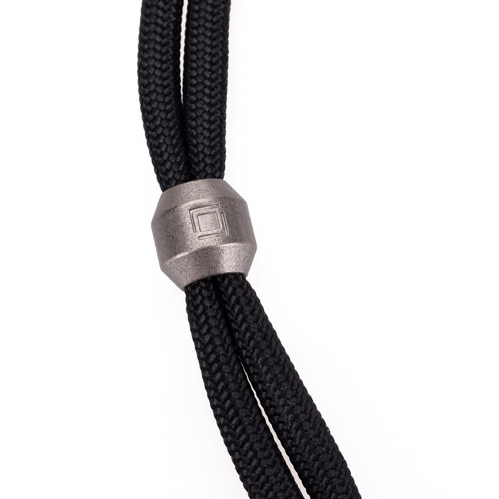 Correa de mano multifuncional de paracord Artisan & Artist (negra)