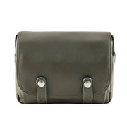 Green leather bag with silver buckles on a white background